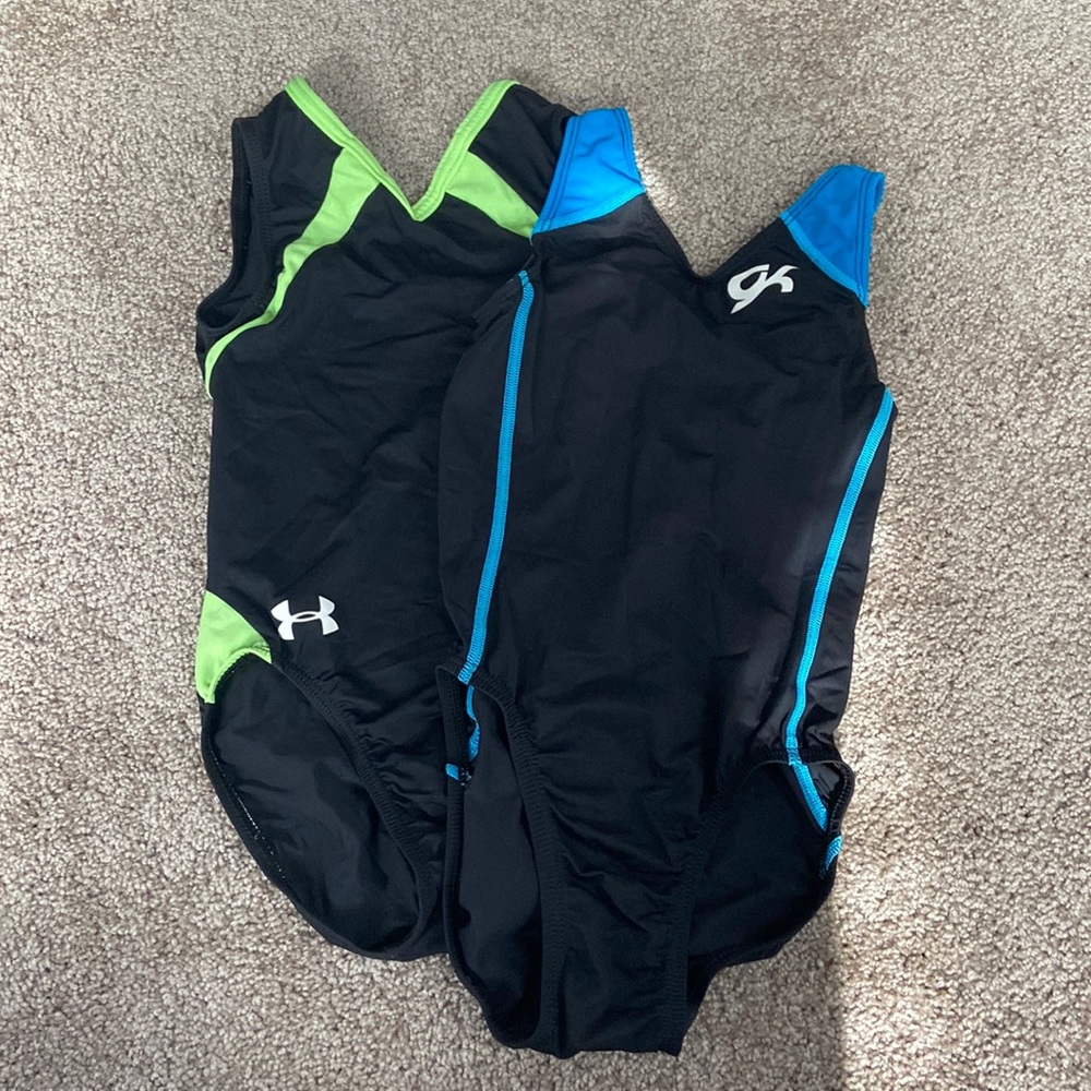 Two gymnastics leotards that are blue and green